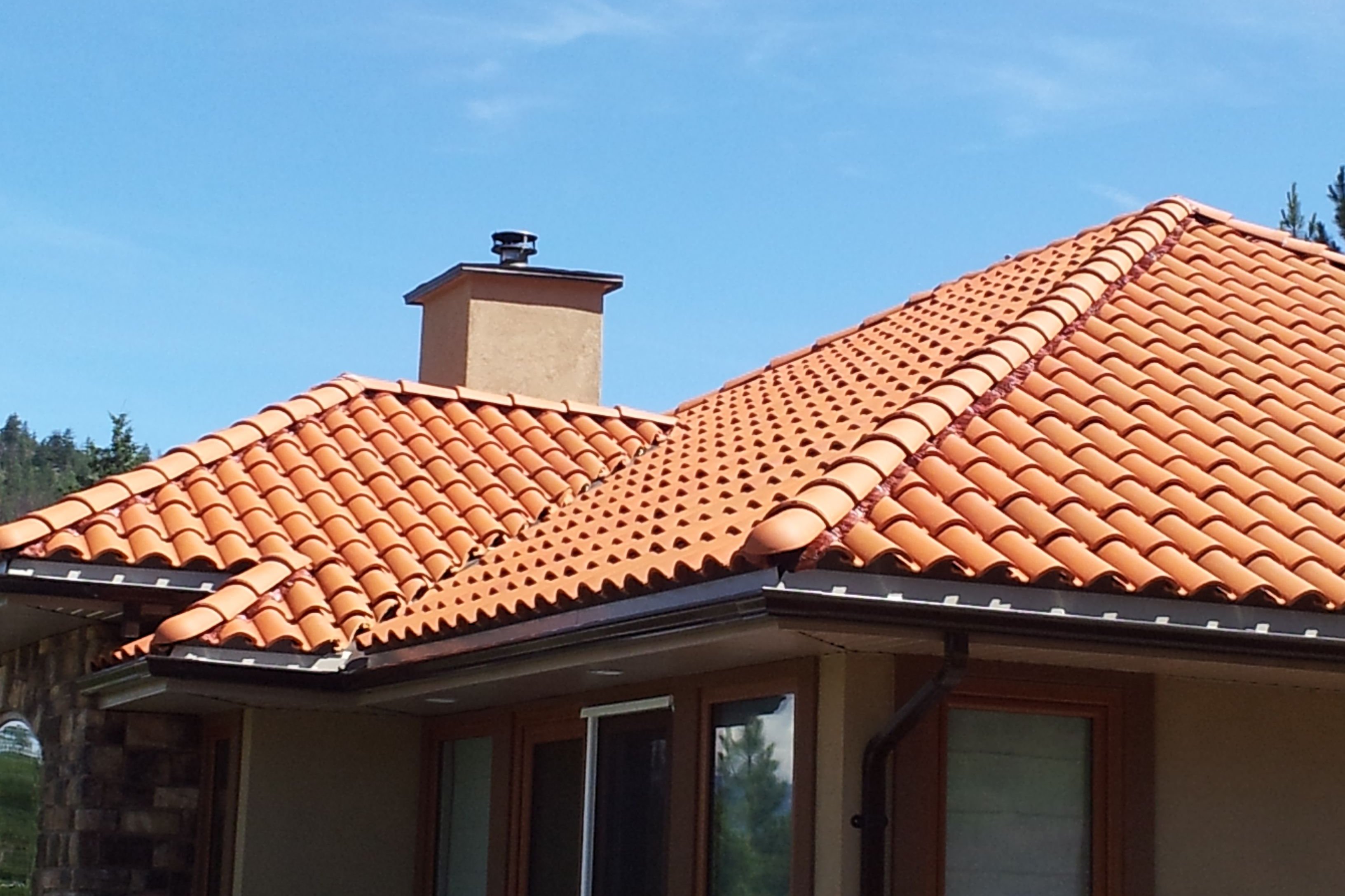 A distant view of a clay tile roof on a traditional building